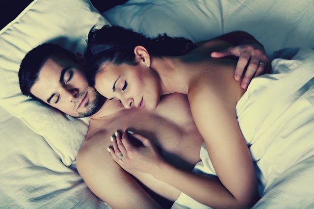 sexy_couple_cuddling_in_bed_jpg